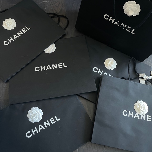 CHANEL Handbags - Authentic set of 6 Chanel Shopping Bags Black with camellia flower